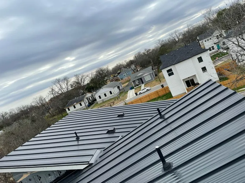 Standing seam metal roof panels with vents for Skylight Repair in Raymore
